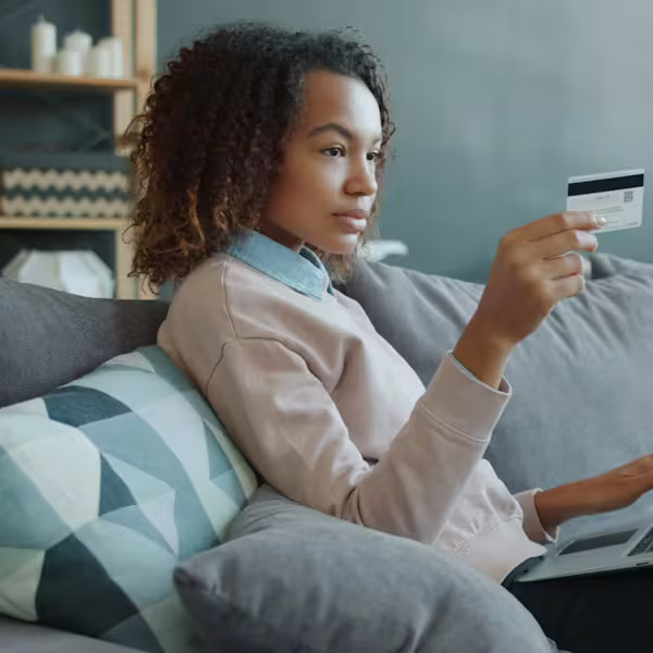 Woman managing her finances from her laptop at home