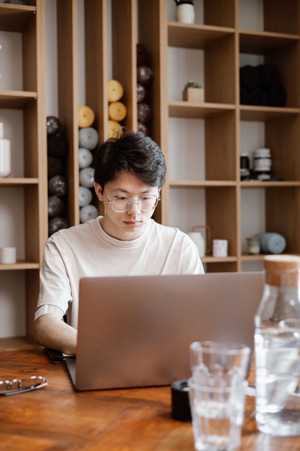 Man focused on his laptop, getting started with investing
